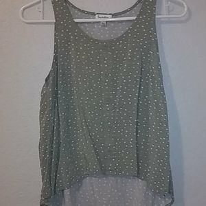 Green shirt with white polka dots